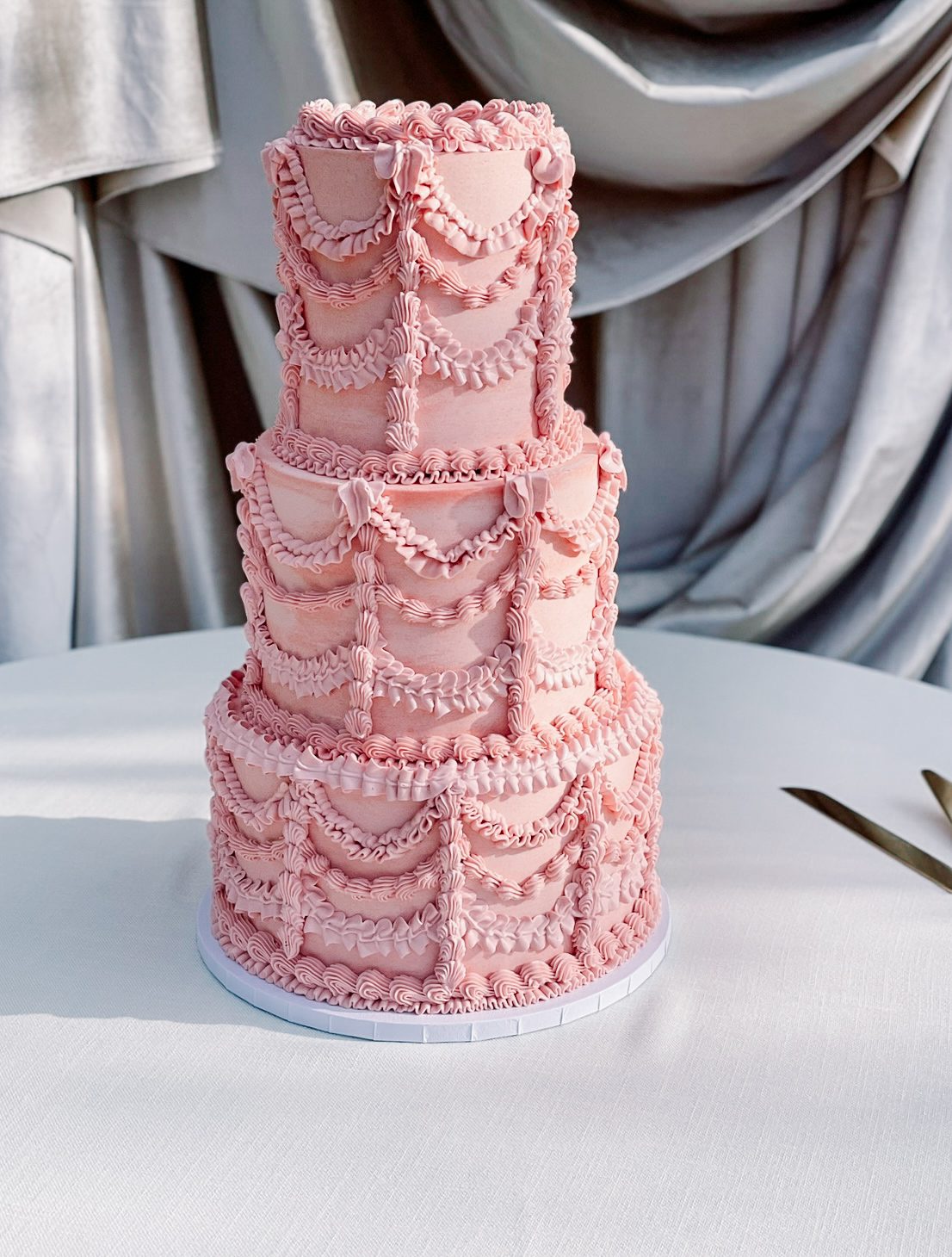 pink vintage piping cake with swags