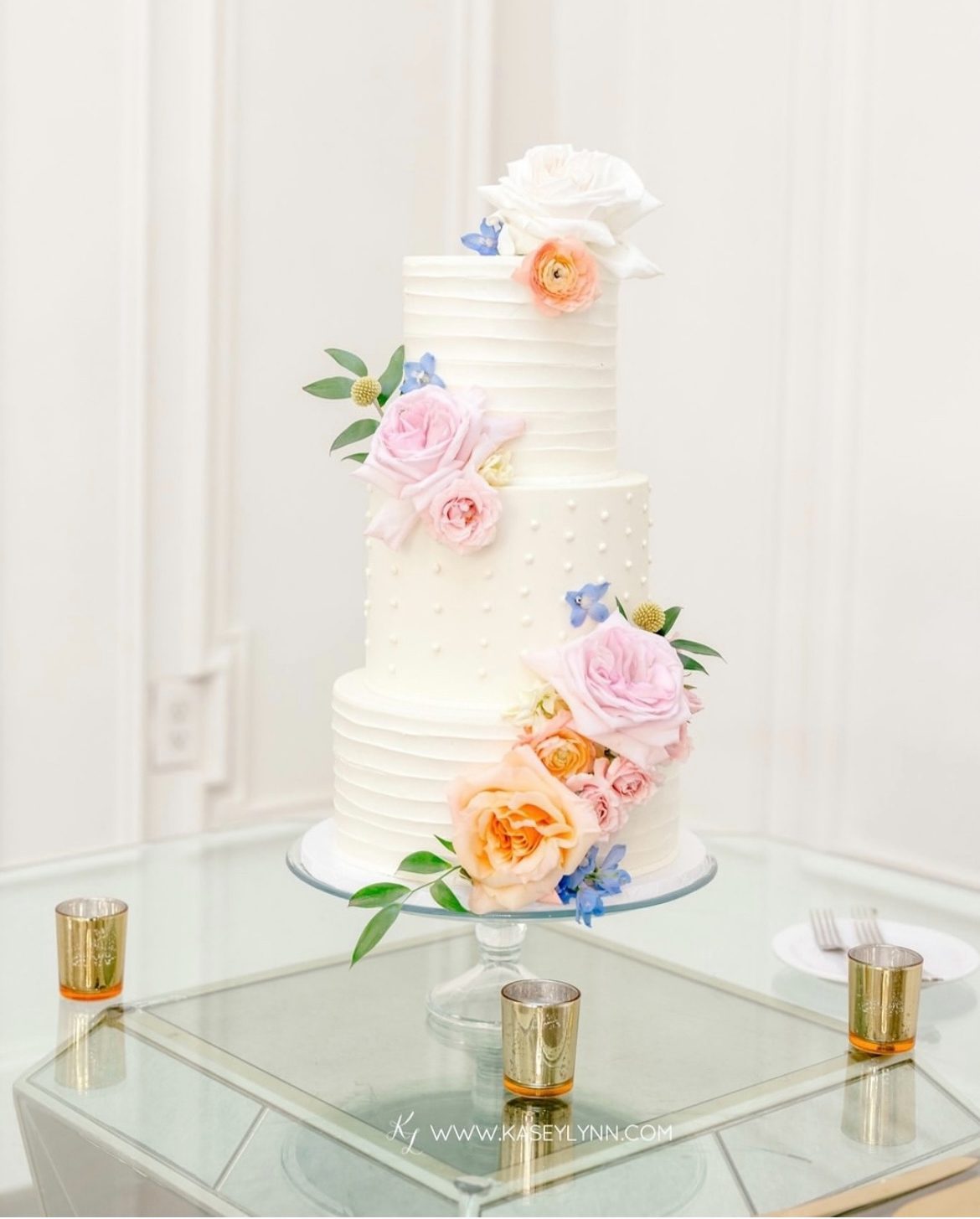 three tier simple buttercream cake with florals