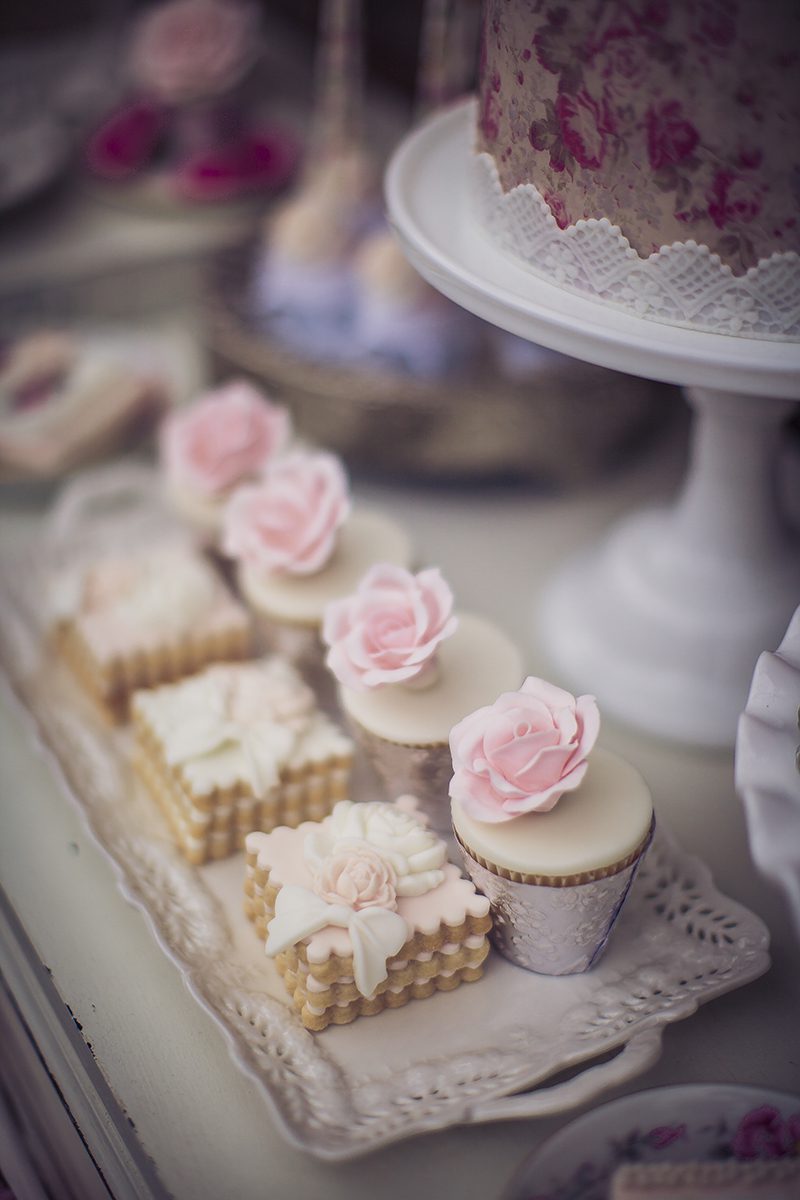 dessert table in pink and white with roses